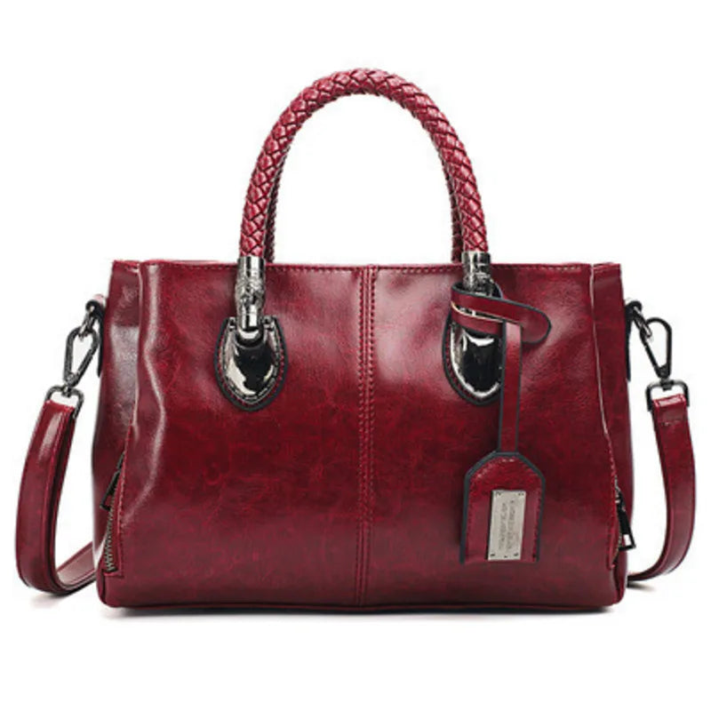 Pia | "Elegant leather handbag with braided handle".-Elly Rose